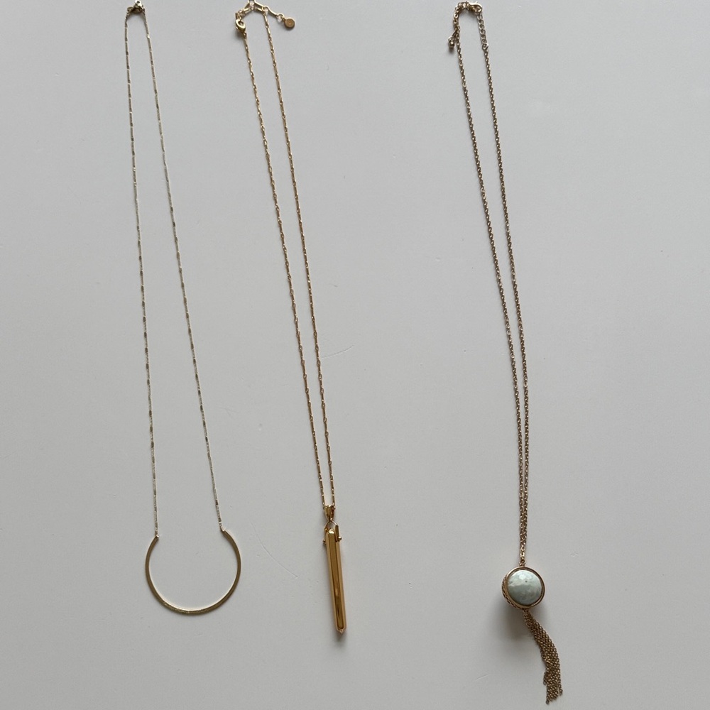 Lot of 3 long gold toned necklaces.  Each about 16 inches long.